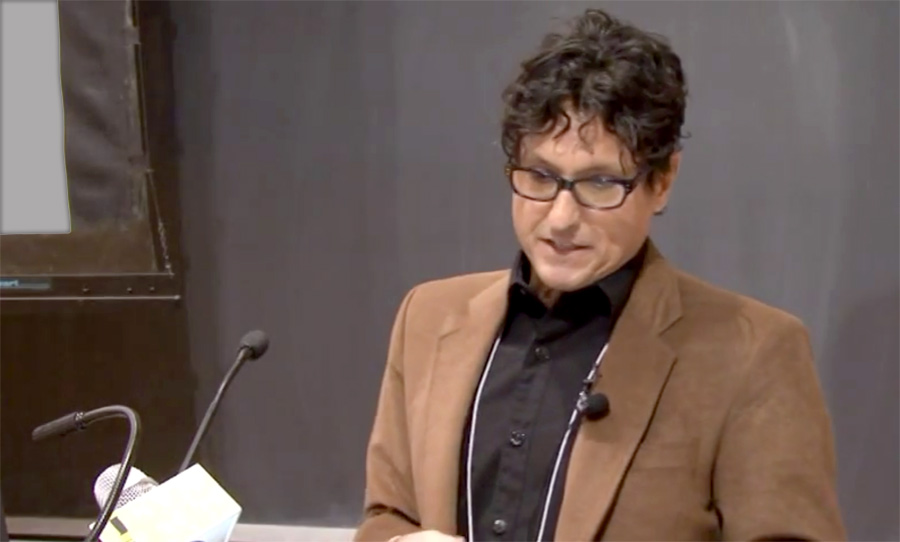 Robert C. Jones speaking at a lectern